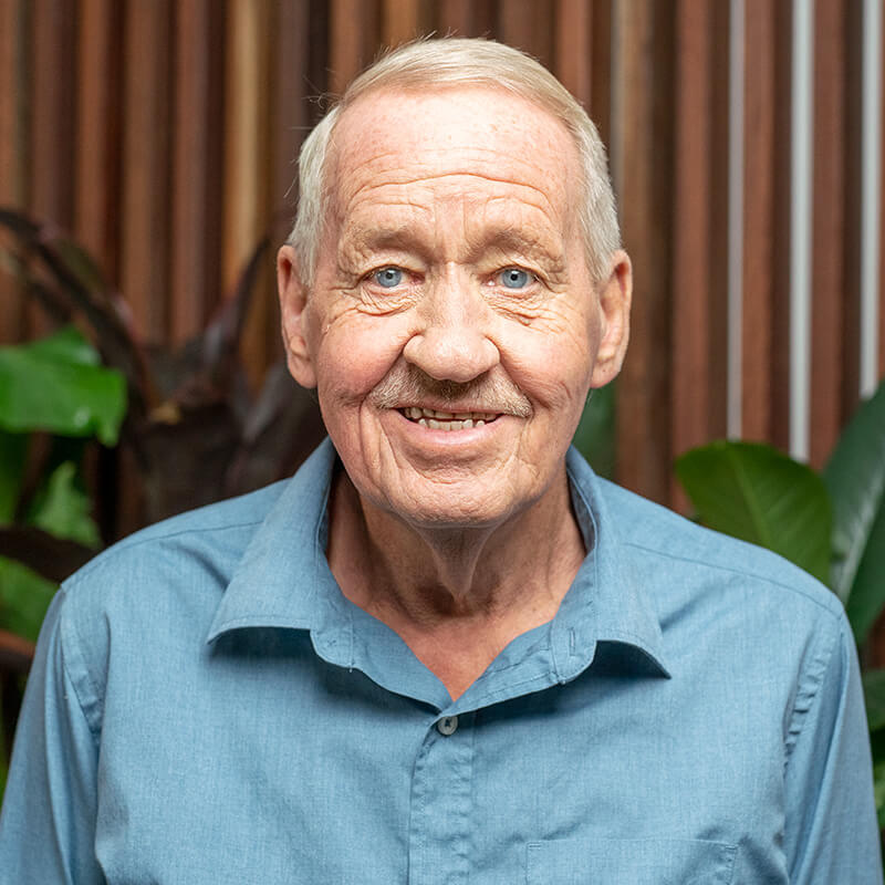 Front on portrait photography of an aged care customer smiling