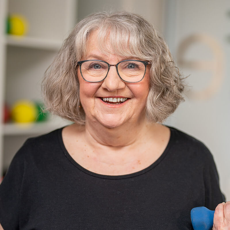 Front on portrait photography of an aged care customer smiling