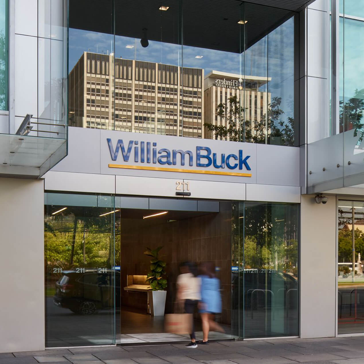 William Buck signage displayed above the entrance to a city building