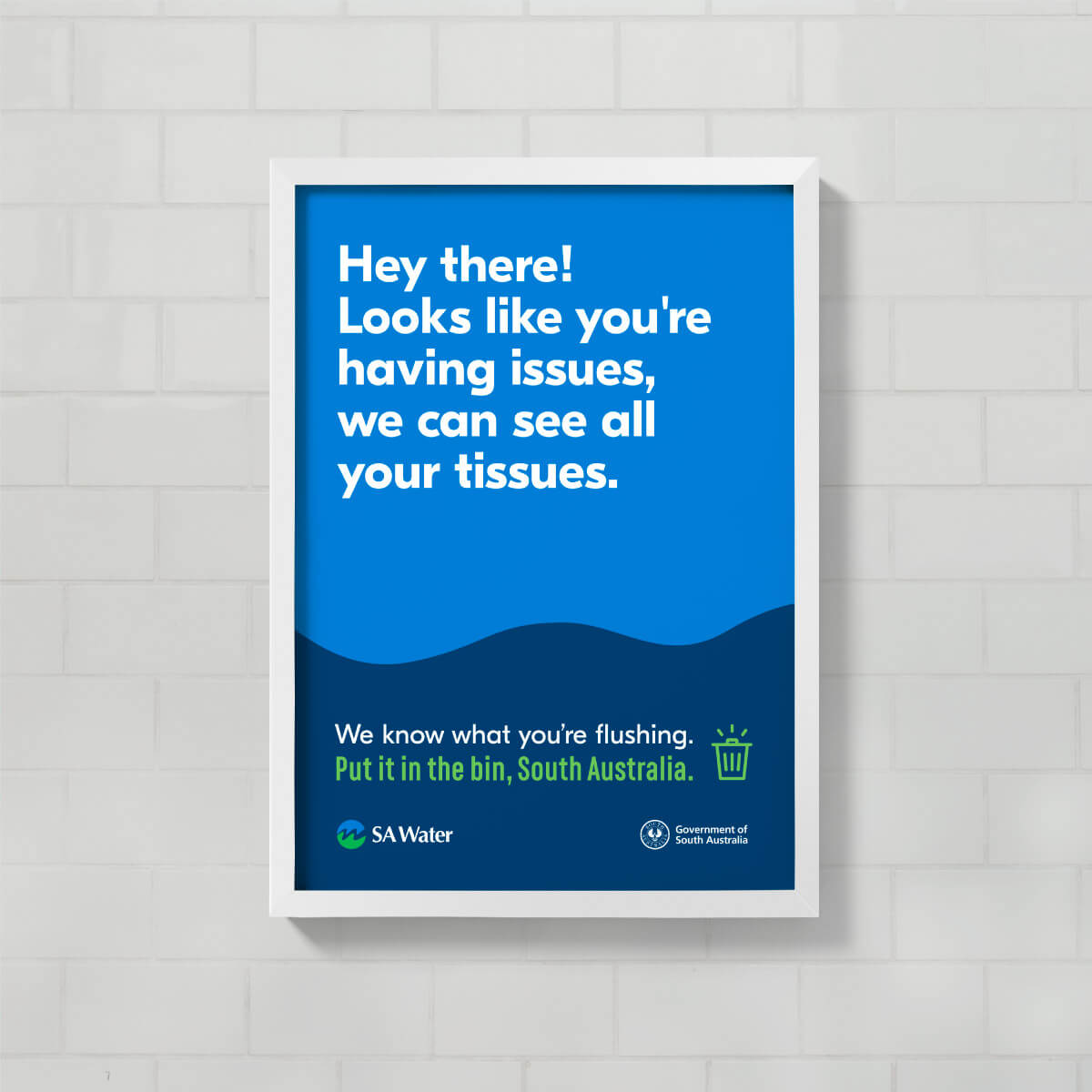 Bathroom stall poster which reads 'Hey there! Looks like you're having issues, we can see all your tissues.'