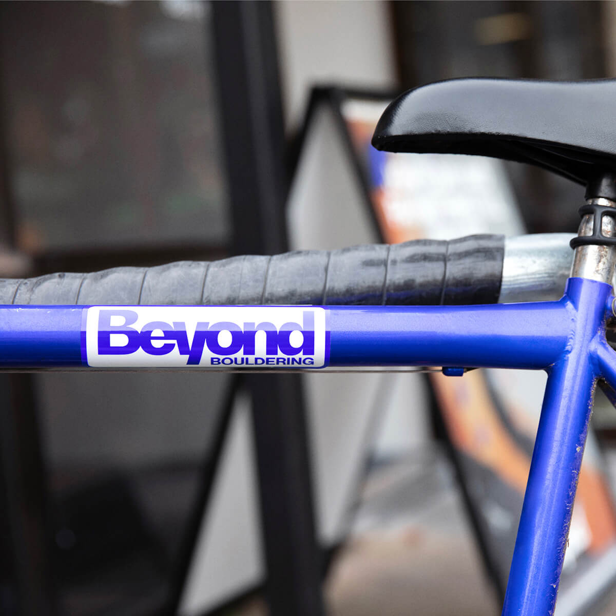 The Beyond Bouldering logo printed on a bike