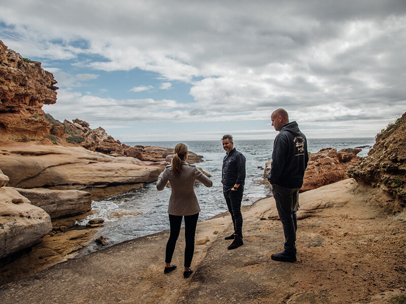Will, Jordaine and the Eyre tourism team talking on the beach