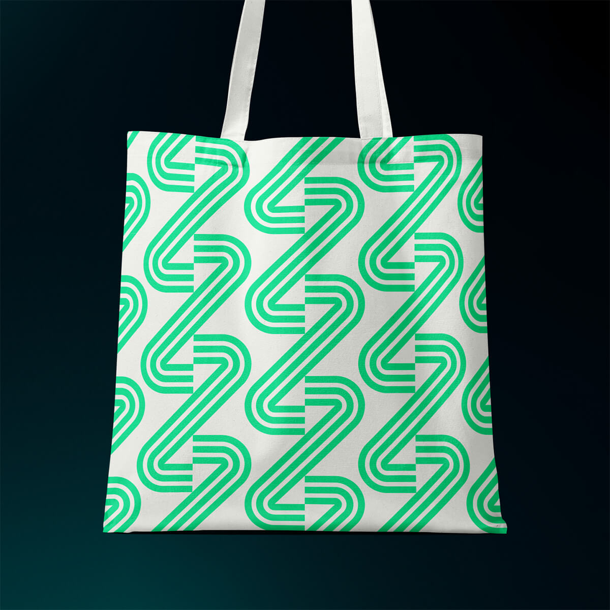 A tote bag with the Savant Energy graphic device printed as a repeated pattern.