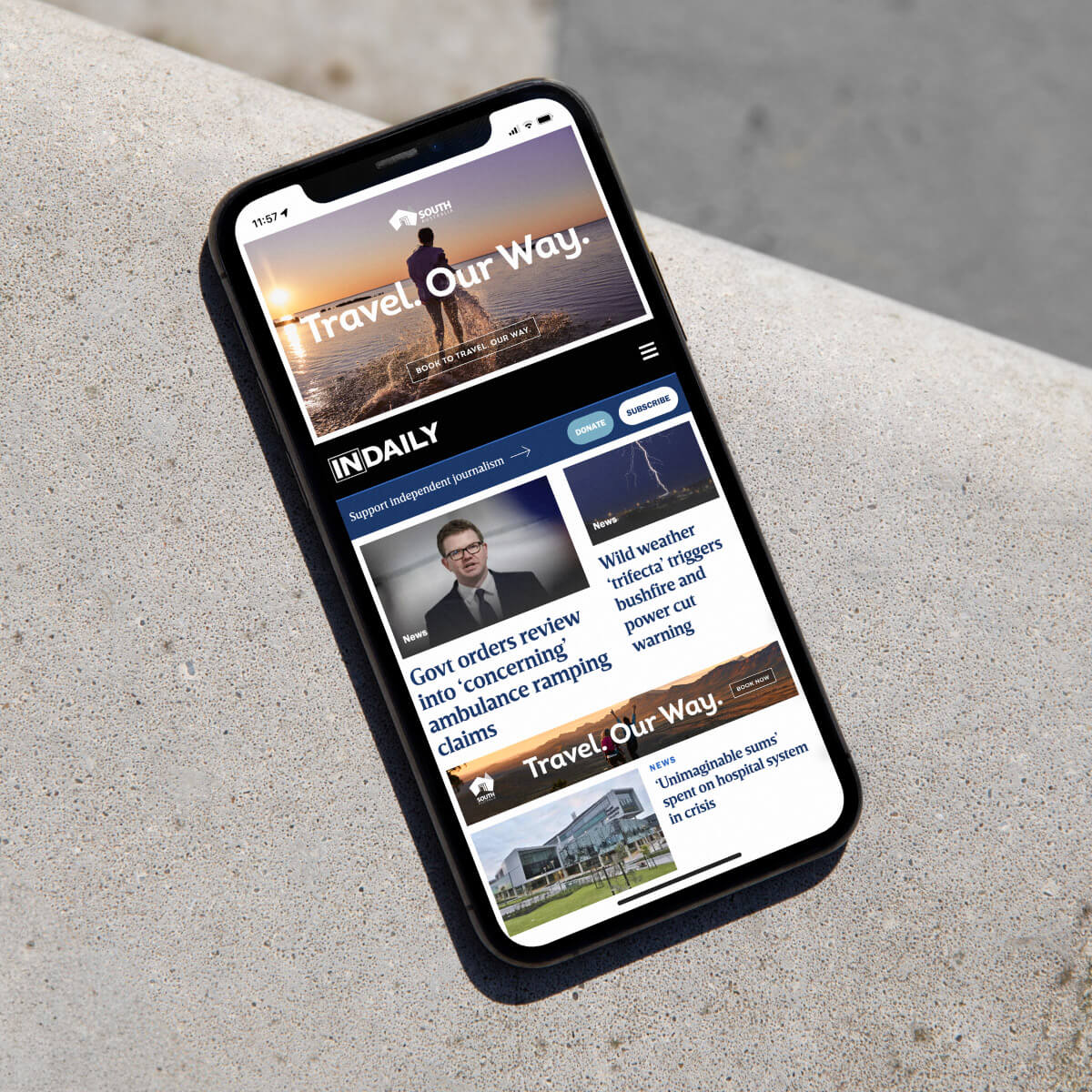 A mobile phone displaying at webpage that has an ad for Travel. Our Way. at the top.