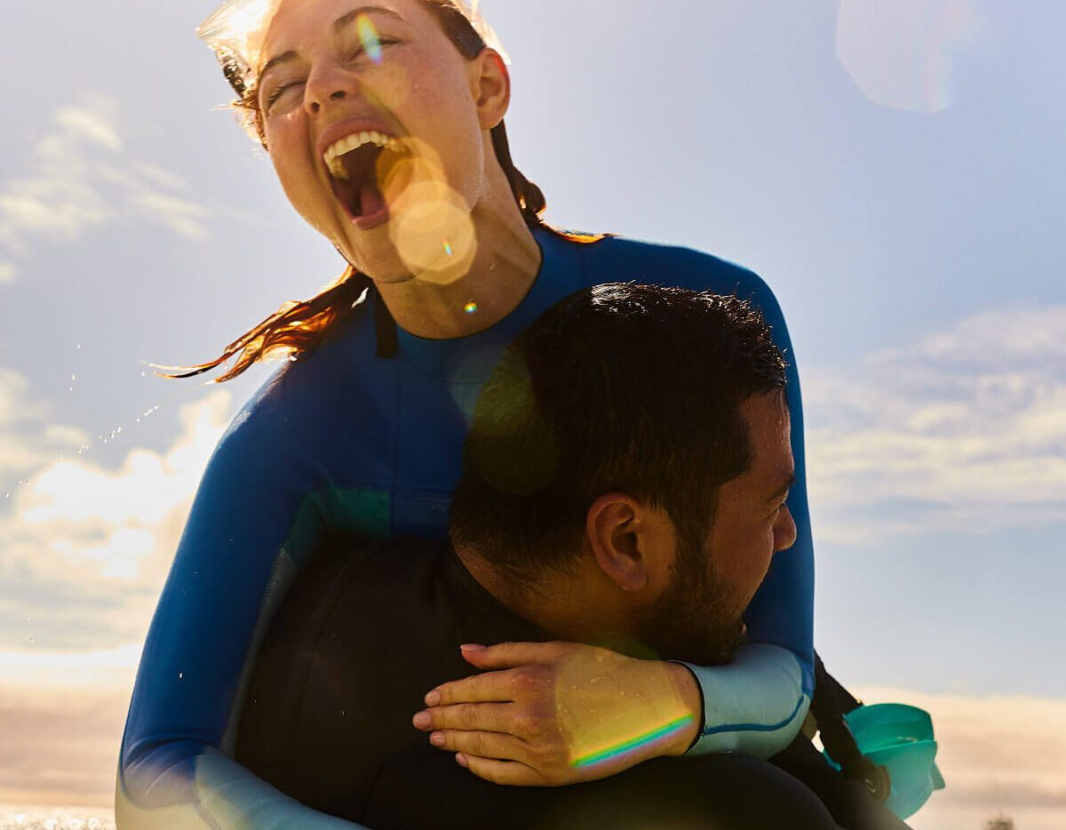 Two happy travellers goofing around in the South Australian ocean.