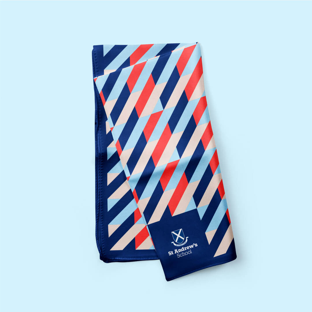 A handkerchief with the St Andrews logo and tartan pattern printed
