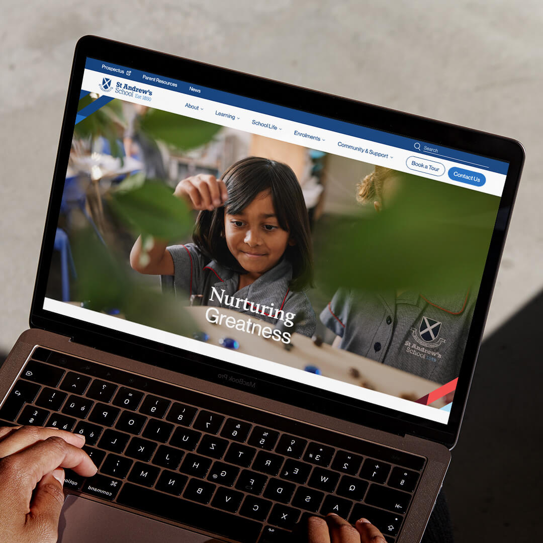 The St Andrews website displayed on a laptop device.