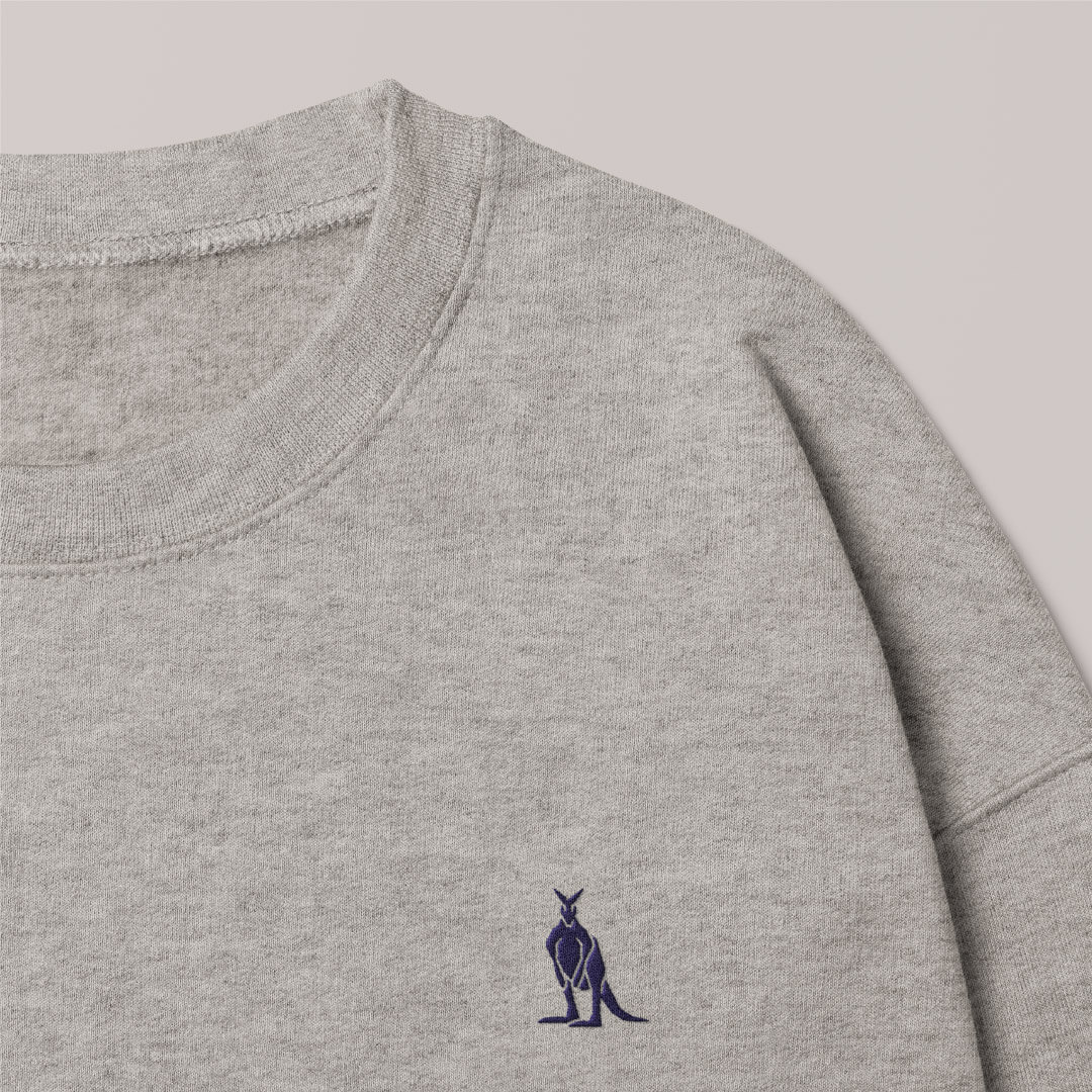 A grey jumper with The Cliffs kangaroo icon embroidered on the left breast pocket area