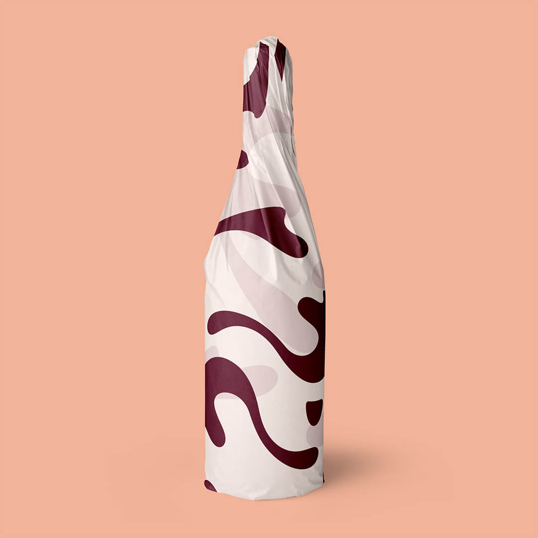 A bottle of wine wrapped in Wine Australia branded wrapping paper