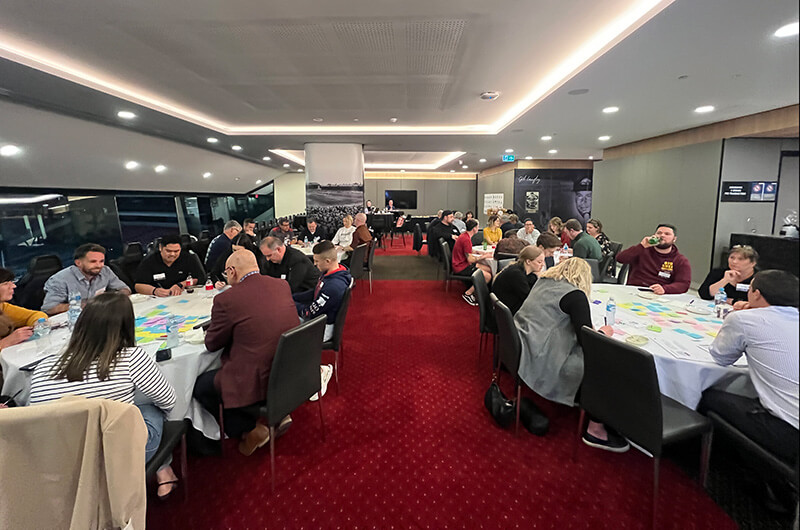 Room full of fans participating in the engagement workshops for the Adelaide Crows brand